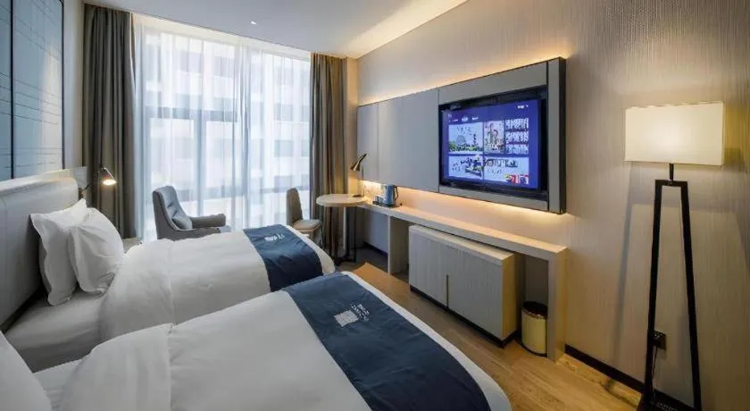 Bed in Echarm Hotel Nanning Dongge Macun Metro Station