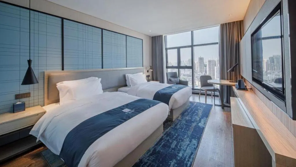 Bed in Echarm Hotel Nanning Dongge Macun Metro Station