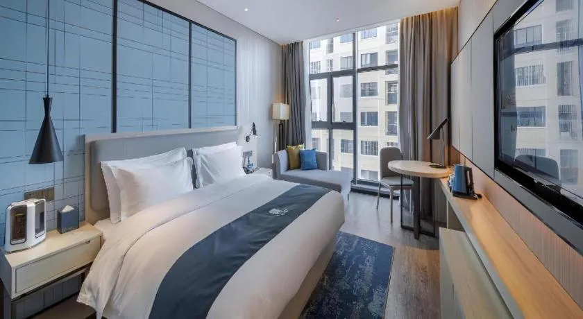 Bed in Echarm Hotel Nanning Dongge Macun Metro Station