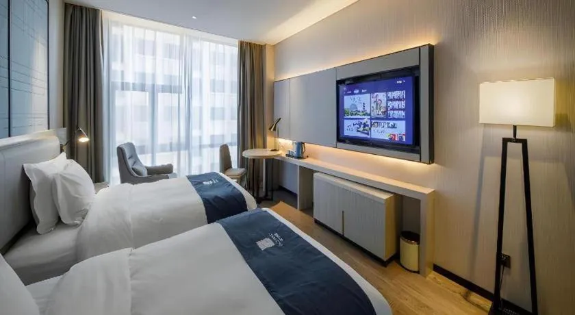 Bed in Echarm Hotel Nanning Dongge Macun Metro Station