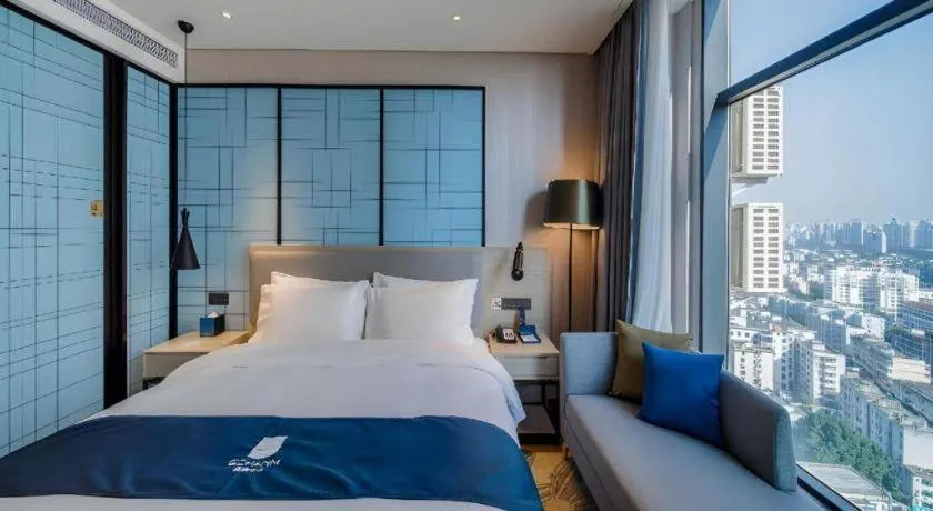 Bed in Echarm Hotel Nanning Dongge Macun Metro Station