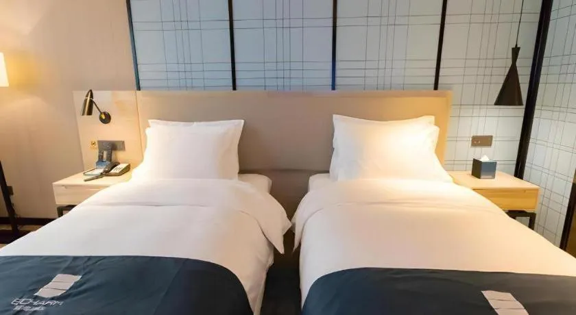 Bed in Echarm Hotel Nanning Dongge Macun Metro Station