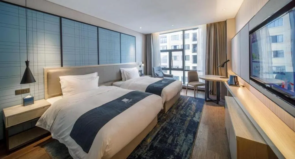 Bed in Echarm Hotel Nanning Dongge Macun Metro Station