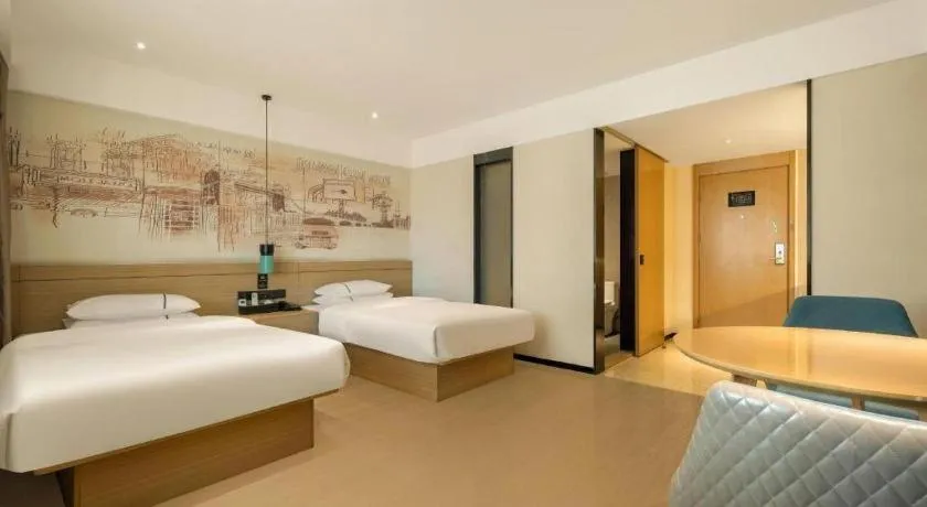 Bed in City Comfort Inn Wuzhou High-speed Railway Station Canghai Lake Park