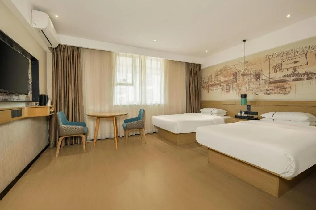 Bed in City Comfort Inn Wuzhou High-speed Railway Station Canghai Lake Park