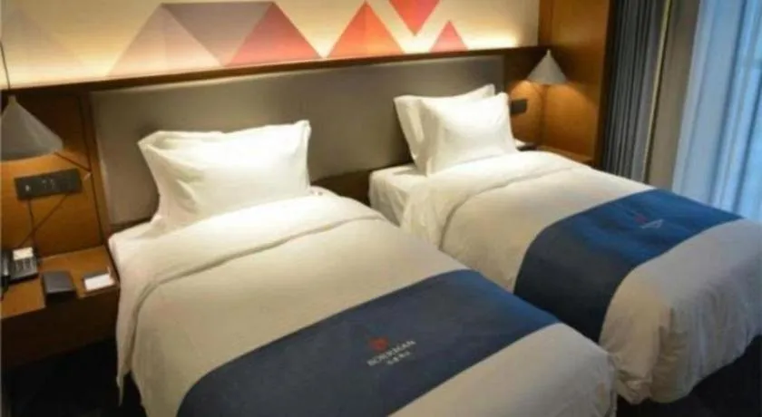 Bed in Borrman Hotel Ji'nan Aoti Center East Provincial Hospital
