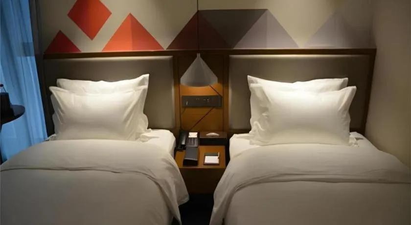 Bed in Borrman Hotel Ji'nan Aoti Center East Provincial Hospital