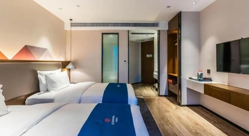 Bed in Borrman Hotel Ji'nan Aoti Center East Provincial Hospital