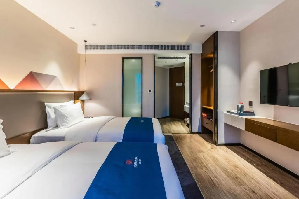 Bed in Borrman Hotel Ji'nan Aoti Center East Provincial Hospital