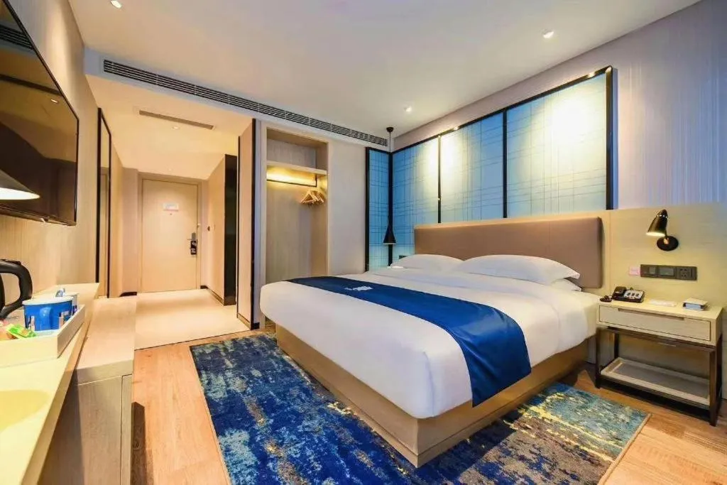 Bed in Echarm Hotel Kunming High-speed Railway South Station Chunrong Street Metro Station