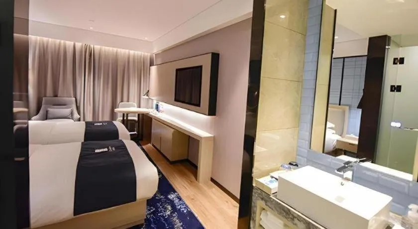 Bed in Echarm Hotel Kunming High-speed Railway South Station Chunrong Street Metro Station
