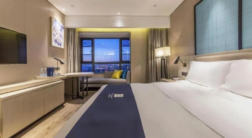 Bed in Echarm Hotel Kunming High-speed Railway South Station Chunrong Street Metro Station