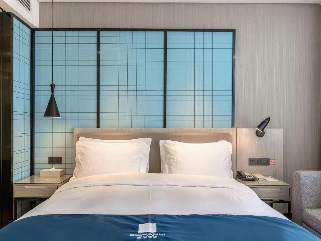 Bed in Echarm Hotel Kunming High-speed Railway South Station Chunrong Street Metro Station