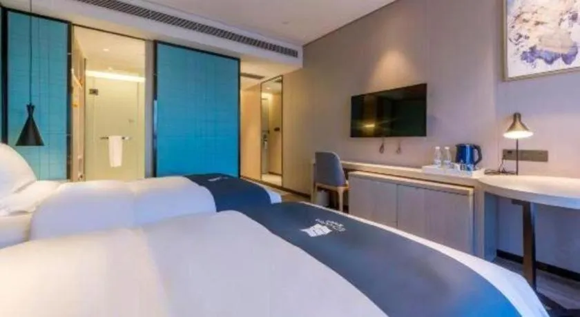 Bed in Echarm Hotel Kunming High-speed Railway South Station Chunrong Street Metro Station