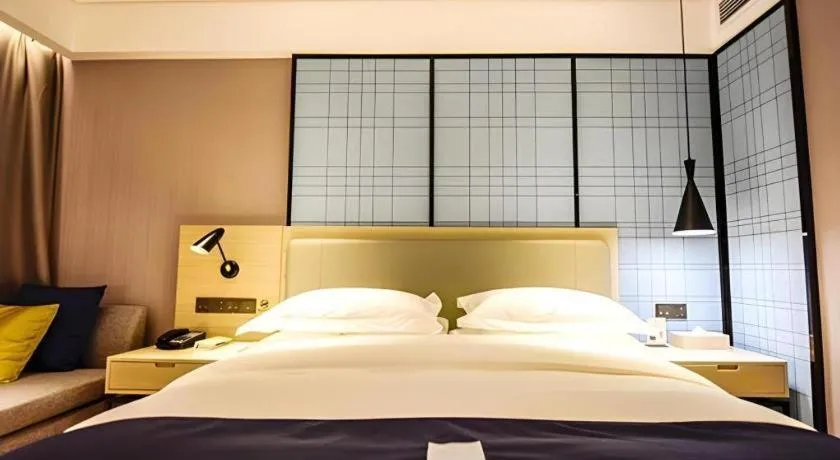 Bed in Echarm Hotel Kunming High-speed Railway South Station Chunrong Street Metro Station