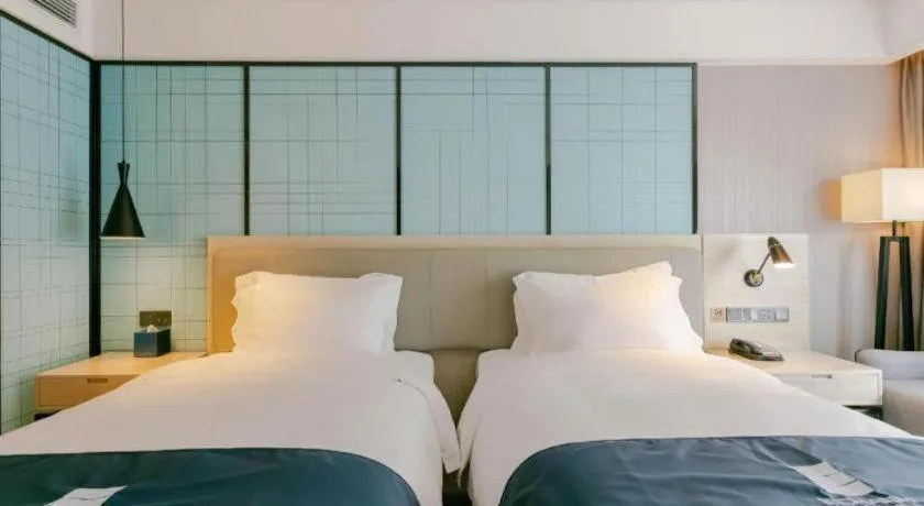 Bed in Echarm Hotel Kunming High-speed Railway South Station Chunrong Street Metro Station