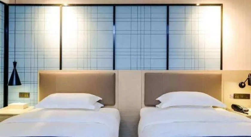 Bed in Echarm Hotel Kunming High-speed Railway South Station Chunrong Street Metro Station