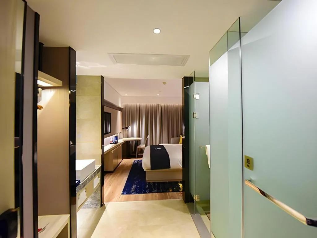 Bed in Echarm Hotel Kunming High-speed Railway South Station Chunrong Street Metro Station