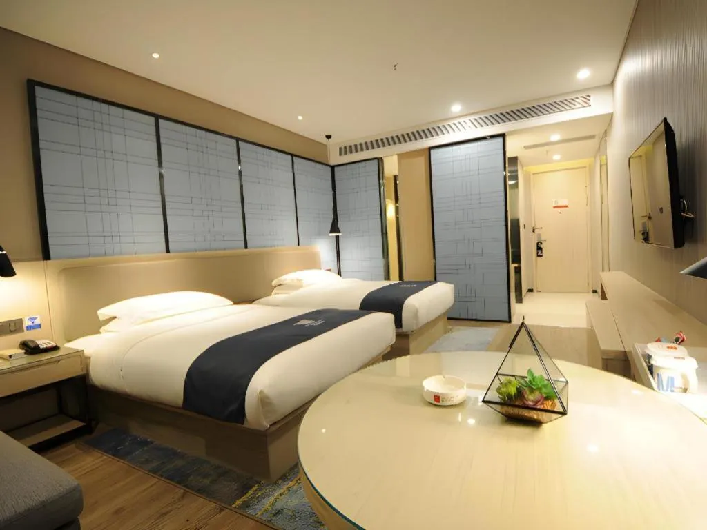 Bed in Echarm Hotel Kunming High-speed Railway South Station Chunrong Street Metro Station
