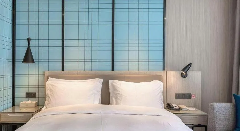 Bed in Echarm Hotel Kunming High-speed Railway South Station Chunrong Street Metro Station