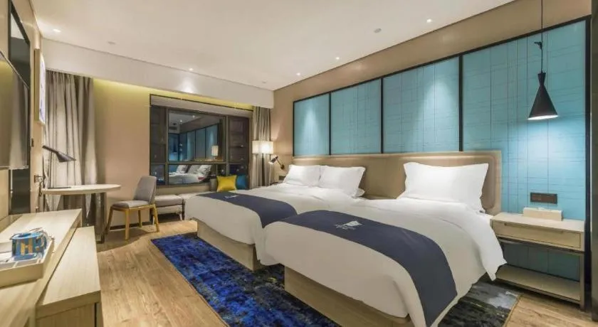 Bed in Echarm Hotel Kunming High-speed Railway South Station Chunrong Street Metro Station