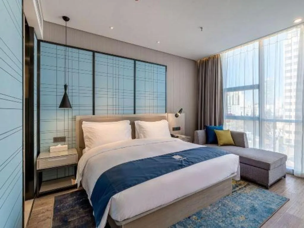 Bed in Echarm Hotel Kunming High-speed Railway South Station Chunrong Street Metro Station