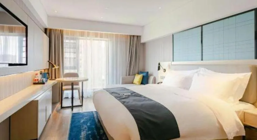 Bed in Echarm Hotel Kunming High-speed Railway South Station Chunrong Street Metro Station