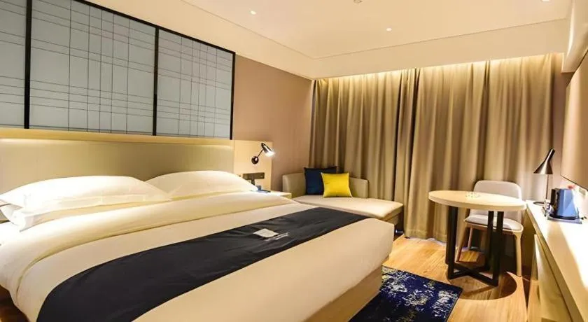 Bed in Echarm Hotel Kunming High-speed Railway South Station Chunrong Street Metro Station