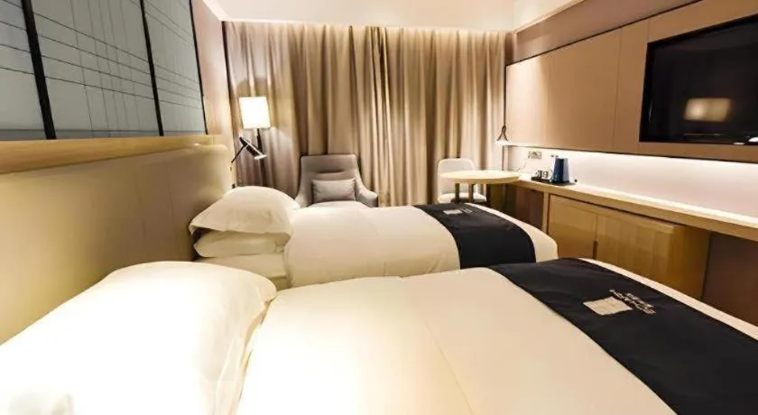 Bed in Echarm Hotel Kunming High-speed Railway South Station Chunrong Street Metro Station