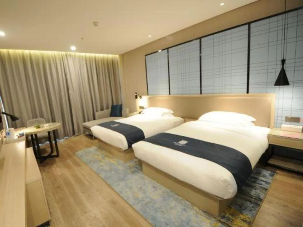 Bed in Echarm Hotel Kunming High-speed Railway South Station Chunrong Street Metro Station