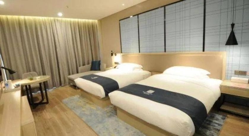 Bed in Echarm Hotel Kunming High-speed Railway South Station Chunrong Street Metro Station