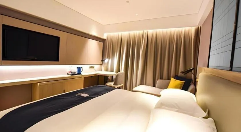 Bed in Echarm Hotel Kunming High-speed Railway South Station Chunrong Street Metro Station