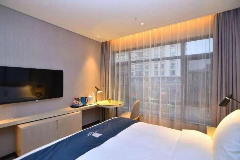 Bed in Echarm Hotel Kunming High-speed Railway South Station Chunrong Street Metro Station