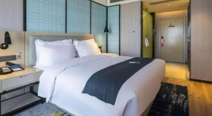 Bed in Echarm Hotel Kunming High-speed Railway South Station Chunrong Street Metro Station