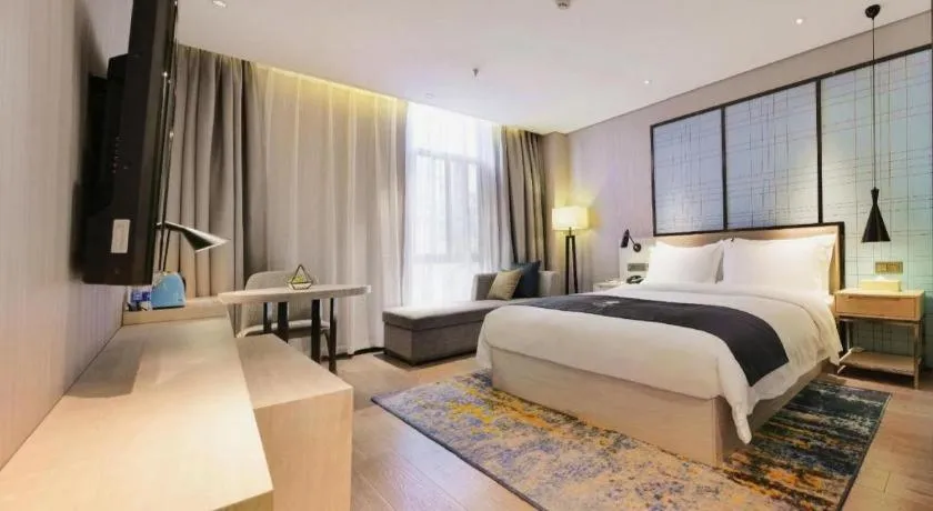 Bed in Echarm Hotel Kunming High-speed Railway South Station Chunrong Street Metro Station