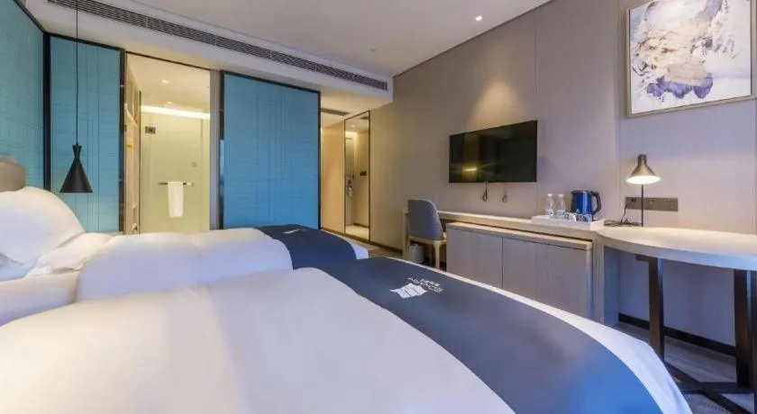 Bed in Echarm Hotel Kunming High-speed Railway South Station Chunrong Street Metro Station