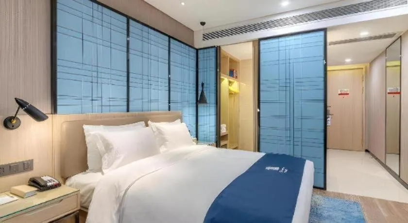 Bed in Echarm Hotel Kunming High-speed Railway South Station Chunrong Street Metro Station