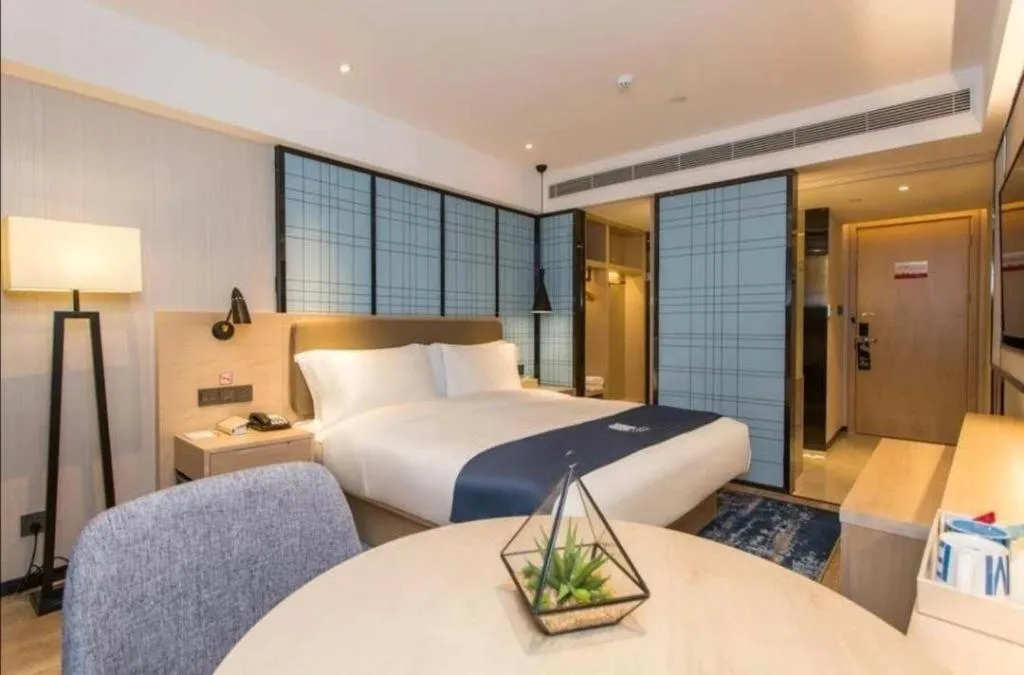 Bed in Echarm Hotel Kunming High-speed Railway South Station Chunrong Street Metro Station