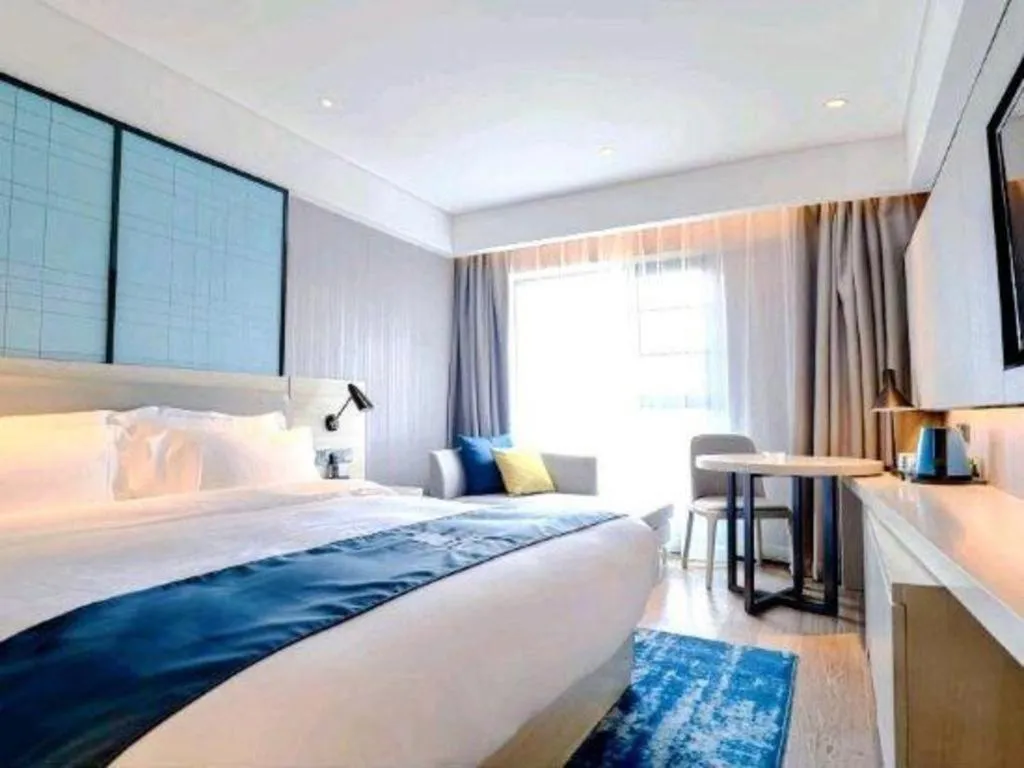 Bed in Echarm Hotel Kunming High-speed Railway South Station Chunrong Street Metro Station