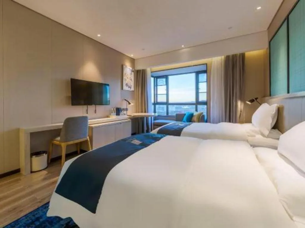 Bed in Echarm Hotel Kunming High-speed Railway South Station Chunrong Street Metro Station