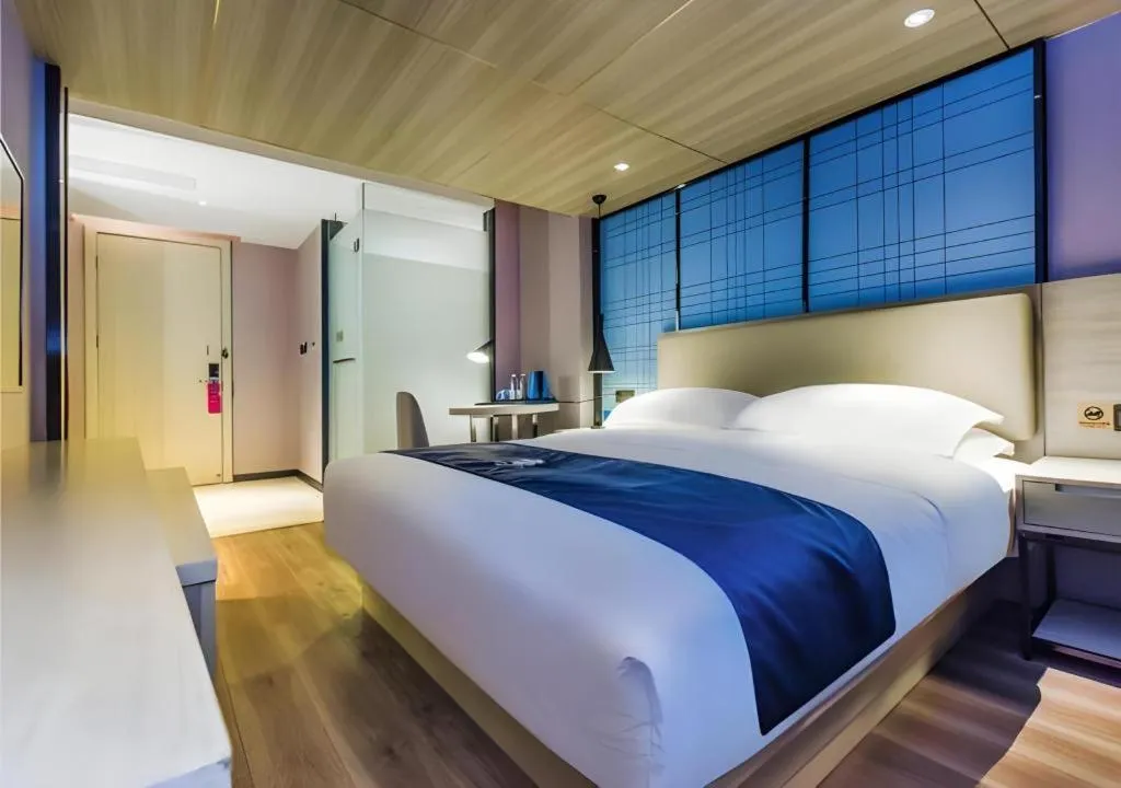 Bed in Echarm Hotel Guiyang Qianling Mountain