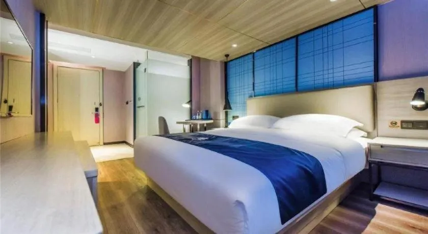 Bed in Echarm Hotel Guiyang Qianling Mountain