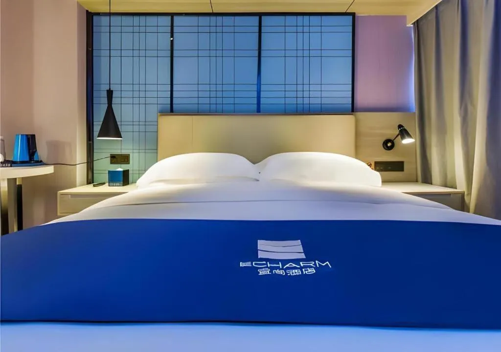 Bed in Echarm Hotel Guiyang Qianling Mountain