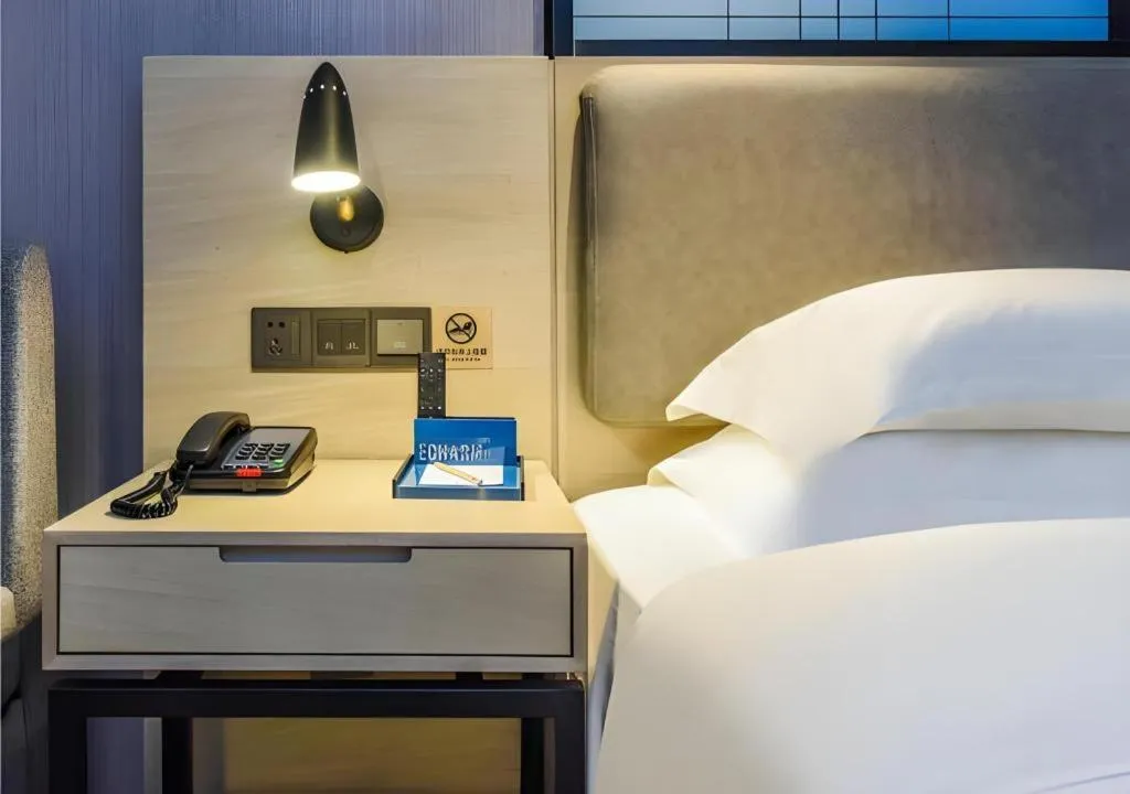 Bed in Echarm Hotel Guiyang Qianling Mountain