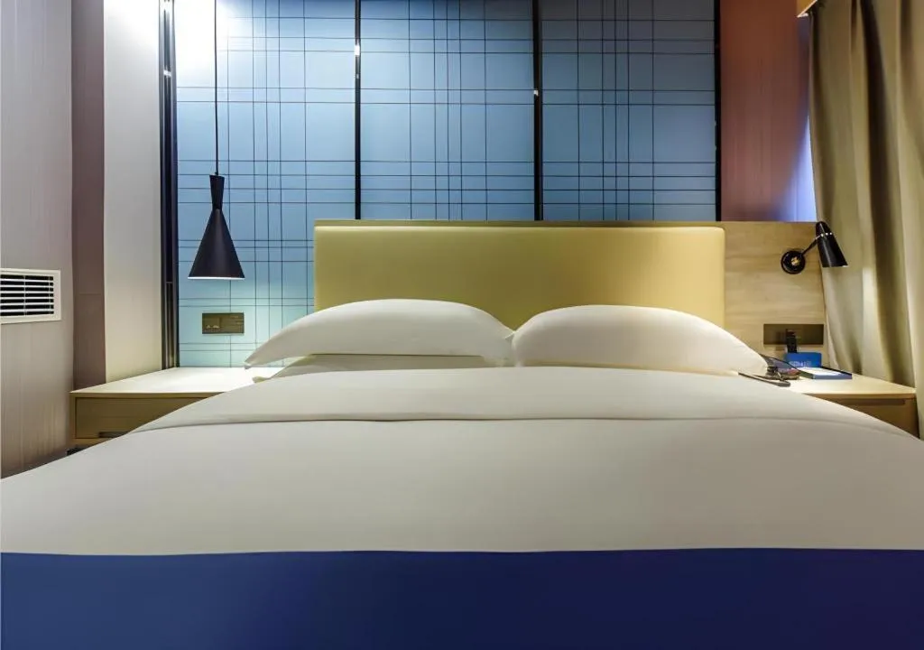 Bed in Echarm Hotel Guiyang Qianling Mountain