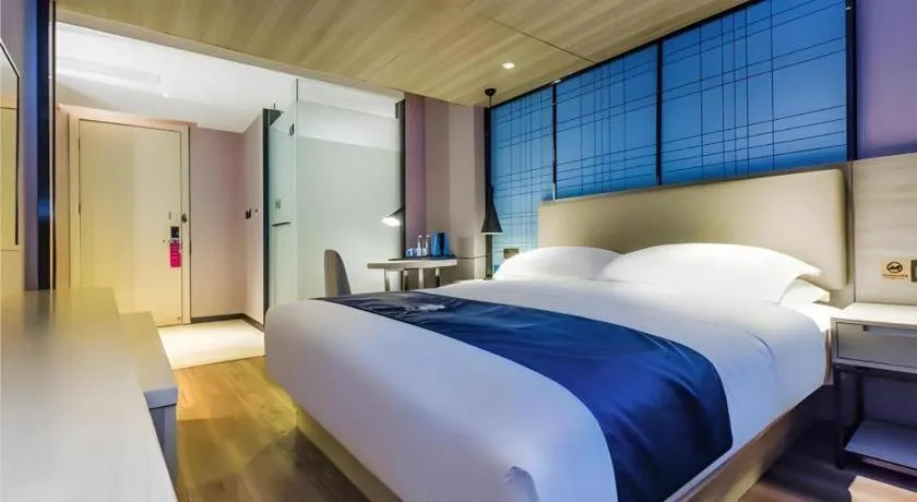 Bed in Echarm Hotel Guiyang Qianling Mountain