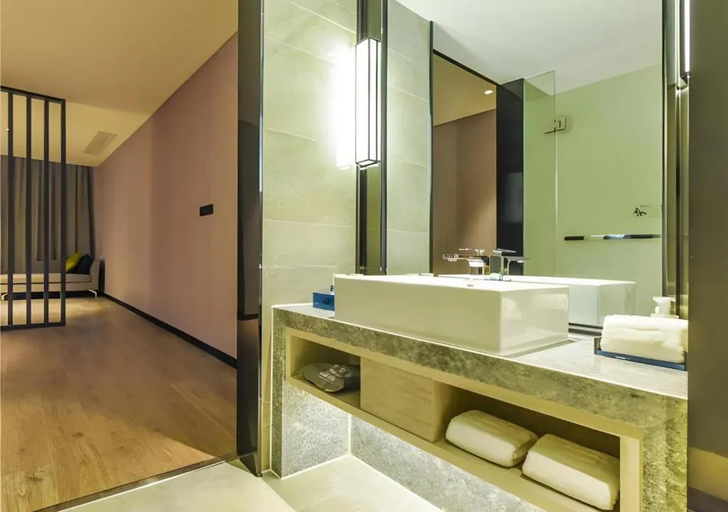 Bed in Echarm Hotel Guiyang Qianling Mountain