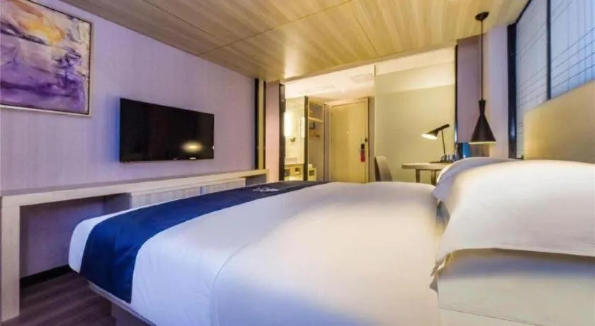 Bed in Echarm Hotel Guiyang Qianling Mountain