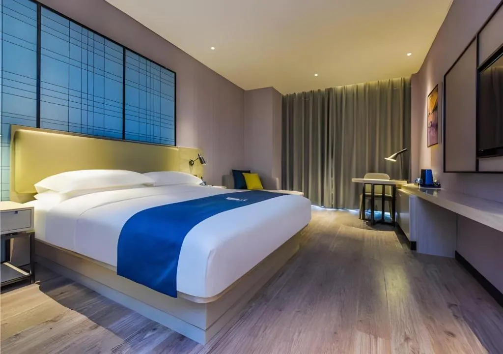 Bed in Echarm Hotel Guiyang Qianling Mountain