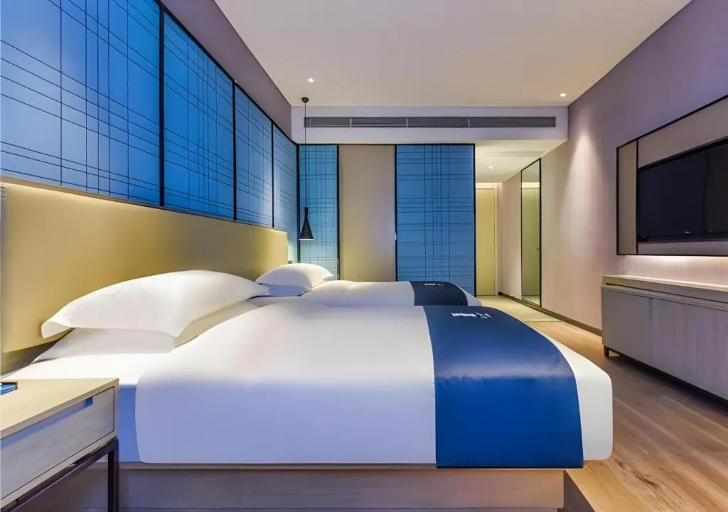 Bed in Echarm Hotel Guiyang Qianling Mountain